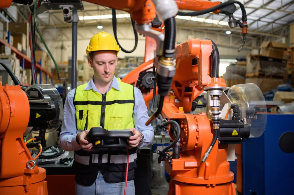 - Techie Consulting Group - a male worker is controlling a welding robot 2025 01 09 18 46 31 utc - Offentlig sektor